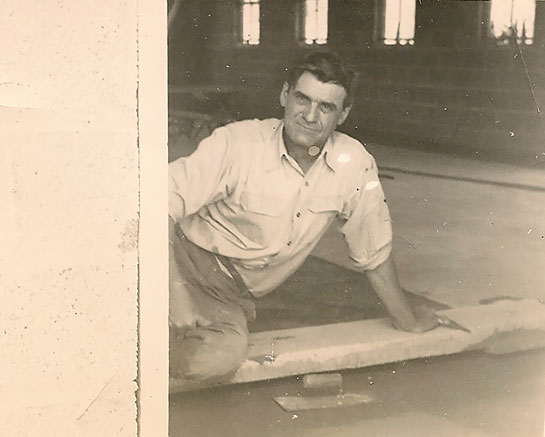 Building the first Dunham Products building, 1948 - Dominic Kaderabik finishing the concrete floor